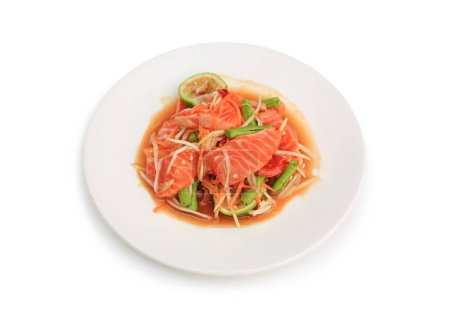 Salmon papaya salad in dish isolated on white background. Image with Clipping path.