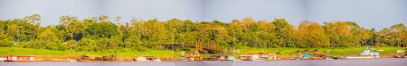 Photo for Tabatinga, Brazil - Sep,  2019: Panoramic view for port on Amazon river  in Tabatinga from the Peru side. South America. Amazon River.  Border of Colombia, Brazil and Peru. Amazonia. - Royalty Free Image