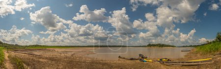 Photo for Paumari, Brazil: - Sep 18, 2018: Wooden boats and kayaks on the bank of Yavari, the tributary of the Amazon river, in river during the low water season. Amazonia. Jungle on the border of Brazil and Peru. South America, - Royalty Free Image