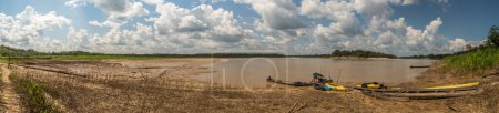 Photo for Paumari, Brazil: - Sep 18, 2018: Wooden boats and kayaks on the bank of Yavari, the tributary of the Amazon river, in river during the low water season. Amazonia. Jungle on the border of Brazil and Peru. South America, - Royalty Free Image