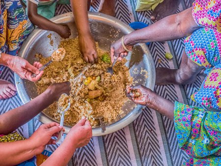 Photo for Senegal family eating together in the traditional manner. Senegal. Africa. - Royalty Free Image