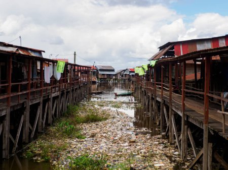 Photo for Belen, Peru - Sep 21, 2017: Wooden houses on stilts in the floodplain of the Itaya River, the poorest part of Iquitos - Beln. Venice of Latin America. Iquitos, South America Amazonia. Low water season. - Royalty Free Image