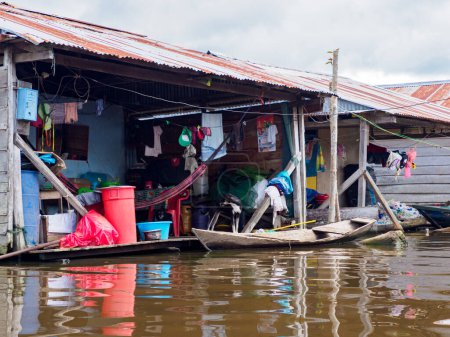 Photo for Iquitos, Peru - Apr, 2022:  Floating shantytown of Beln consisting of scores of huts, built on rafts, which rise and fall with the river. Latin America. - Royalty Free Image