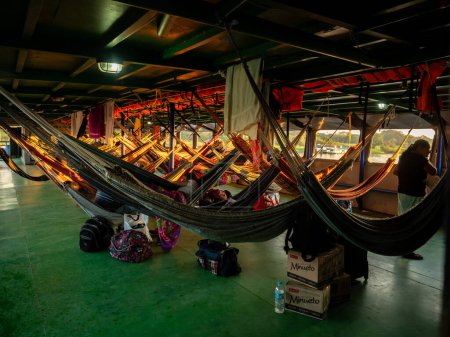 Foto de Amazon River, Peru - March 25, 2018: Beautiful, colorful hammocks on the cargo boat. Amazonia. Southj Ameirca - Imagen libre de derechos