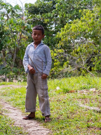 Foto de San Pedro, Brazil - Sep 2017: Portrait of a boy with bow with an arrow-  local inhabitant of the Amazon rain forest.  Amazonia. Latin America - Imagen libre de derechos