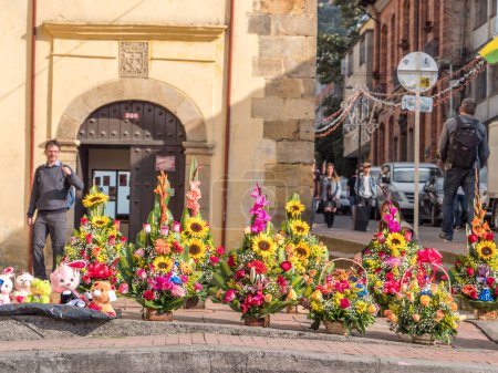Photo for Bogota, Colombia - November 23, 2018: Baskets of colorful flowers on the street of Bogota. Colombia. Latin America. - Royalty Free Image