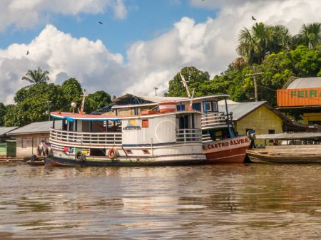 Photo for Benjamin Constant, Brazil - May 10, 2016: Boat in  the port of Amazon river. South America. Amazon River.  Tres fronteras. Rain Forest of Amazonia. - Royalty Free Image