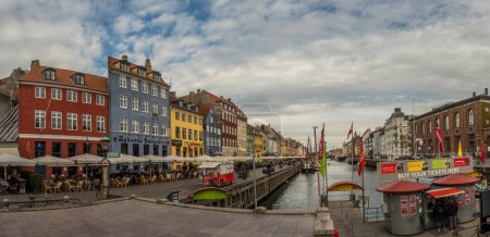 Photo for Nyhavn (New Harbour), Copenhagen, Denmark - 14 JMay 2019: Panoramic view of Nyhavn pier with color buildings, ships, yachts and other boats in the Old Town of Copenhagen, Denmark, Europe - Royalty Free Image