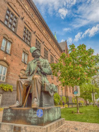 Photo for Copenhagen, Denmark - 1 May 2019 - Bronze statue of Hans Christian Andersen  by sculptor Henry Luckow-Nielsen next to City Hall in Kopenhagen - Royalty Free Image