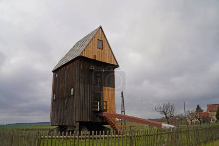 Foto de Old trestle windmill in Mittelpellnitz in Germany under restoration - Imagen libre de derechos