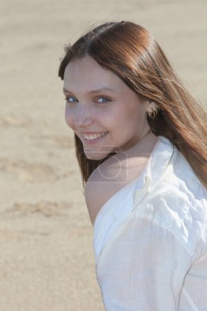 Photo for Portrait of a smiling girl outdoors - Royalty Free Image
