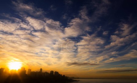 Photo for Beautiful sunset over the city and the sea - Royalty Free Image