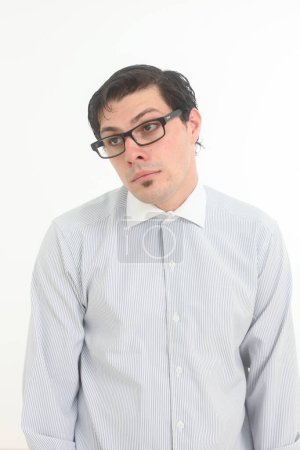 shy and insecure male nerd wearing glasses on white background