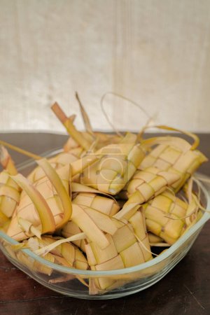 Ketupat rice dumpling special dish at ied mubarak on table wood