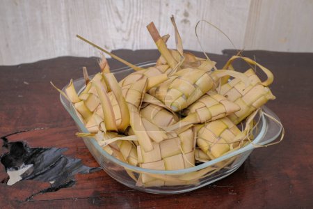 Ketupat rice dumpling special dish at ied mubarak on table wood