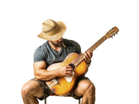 Portrait of muscular man playing classic guitar sitting on chair. Isolated on white background in studio shot