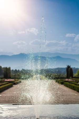 Photo for A fountain spewing water into the air. Photo of a beautiful fountain in full flow, capturing the mesmerizing movement of water - Royalty Free Image