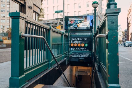 Photo for New York, USA - November 21, 2022: Entrance and stairs down to Bleecker Street subway station in New York, USA. New York City Subway is one of the world's oldest public transit systems. - Royalty Free Image