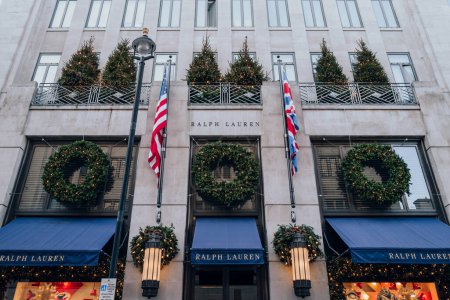 Photo for London, UK - December 26, 2022: Christmas decoration on the exterior of Ralph Lauren store on New Bond Street, one of the most famous streets for luxury shopping in London. - Royalty Free Image