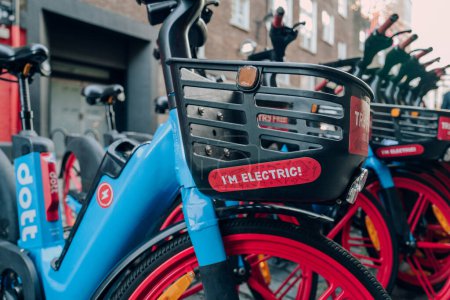 Photo for London, UK - December 26, 2022: Close up of I'm Electric sign on Dott bike parked on a street in Soho. Dott's mission is to make micromobility accessible for all. - Royalty Free Image