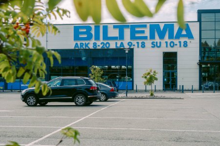 Photo for Helsinki, Finland - August 22, 2022: BILTEMA store. Blue sign above main entrance to building. Car parking in front exterior facade of store - Royalty Free Image