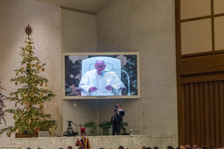 Photo for Vatican City, Vatican - December 7, 2022: View on TV screen with Pope Francis on Papal Audience in the Paul VI hall. - Royalty Free Image