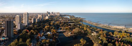 Photo for Beautiful aerial drone panorama of the Lincoln Park neighborhood overlooking the zoo and South Pond and Lagoon along the lakefront on a sunny autumn day. - Royalty Free Image