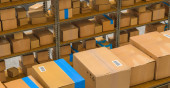 warehouse with shelves and cardboard boxes, Packed courier delivery concept image Poster #644332412