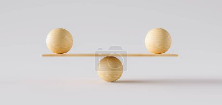 balance en bois équilibrant deux grosses boules wodden. Concept d'harmonie et d'équilibre