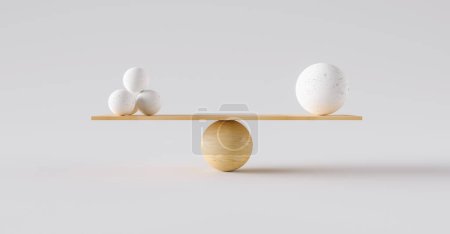 Téléchargez les photos : Balance en bois équilibrant une grosse boule et quatre petites. Concept d'harmonie et d'équilibre - en image libre de droit