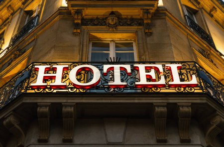 Photo for Illuminated hotel sign taken at night - Royalty Free Image