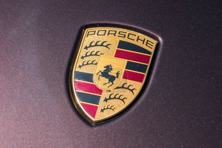 Photo for AACHEN, GERMANY MARCH, 2017: Porsche Sign Close Up on a car. Ferdinand Porsche founded the company in 1931 with main offices in the centre of Stuttgart. - Royalty Free Image
