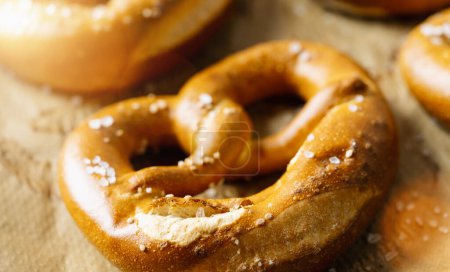 Fresh pretzels on baking paper, Bavarian homemade traditional food