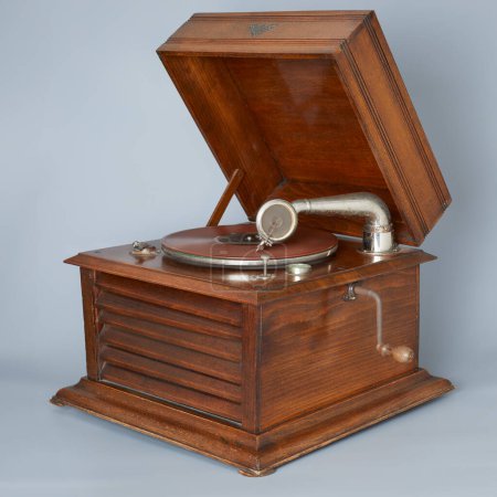 Old vintage wooden 78 rpm record player isolated in studio