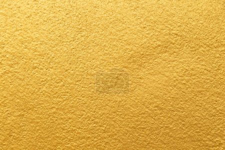 Téléchargez les photos : Golden color with an old grunge wall concrete texture as a background. - en image libre de droit