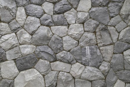 Foto de Full frame shot of marble rock wall texture as background. - Imagen libre de derechos