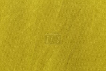Foto de Color amarillo ropa deportiva tela camiseta de fútbol jersey textura y fondo textil. - Imagen libre de derechos