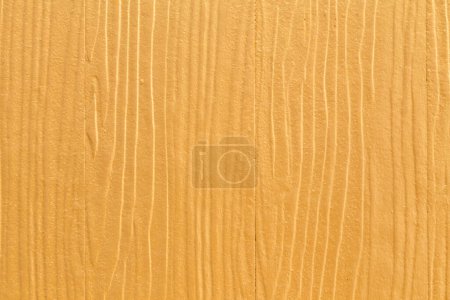 Foto de Color amarillo con una textura de pared de madera vieja como fondo. - Imagen libre de derechos