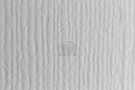 Foto de White color with an old wooden wall texture as a background. - Imagen libre de derechos