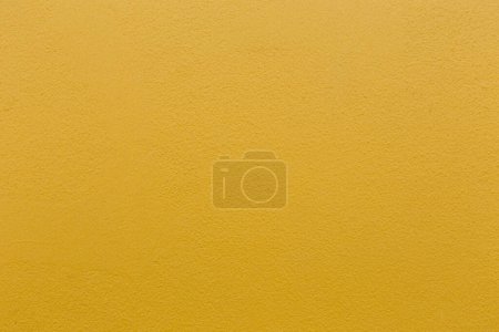 Foto de Color amarillo con una vieja textura de hormigón de pared grunge como fondo. - Imagen libre de derechos