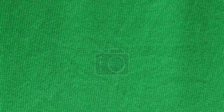 Téléchargez les photos : Couleur verte vêtements de sport tissu maillot de football texture jersey et fond textile, large bannière. - en image libre de droit