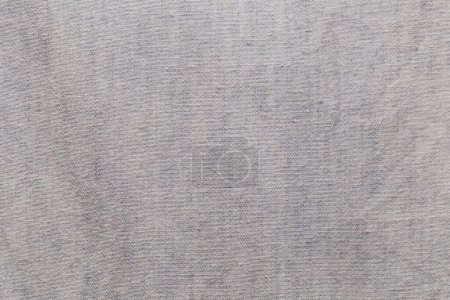 Foto de Primer plano del fondo de la tela y la textura de los pantalones vaqueros de manga larga de color azul. - Imagen libre de derechos