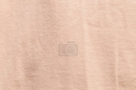 Foto de Paño de tela de color naranja grisáceo textura de poliéster y fondo textil. - Imagen libre de derechos