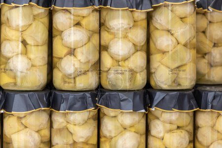 Photo for Close up in horizontal view of several glass jars with preserved artichoke hearts. food preservation concept - Royalty Free Image