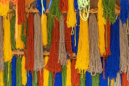 Photo for Colorful background in horizontal view with several wools skeins dyed in different colors - Royalty Free Image
