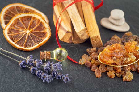 Photo for Smudge kit for spiritual practices with natural elements: Palo Santo sticks, dried lavender, SPA stones, essence and resin. - Royalty Free Image