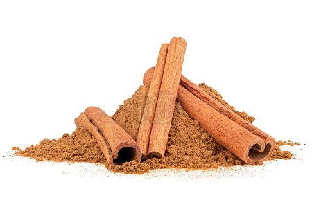 Cinnamon sticks and ground cinnamon isolated on a white background. Cinnamon spice.