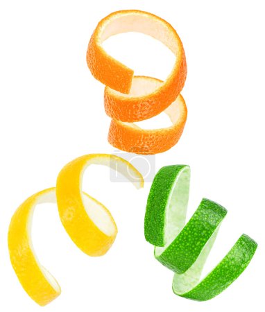 Collection of fresh citrus fruit peels isolated on a white background. Citrus zest spiral - orange, lemon and lime fruit.