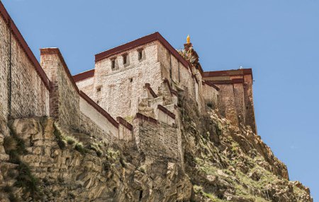 Photo for Gyantse Dzong or Gyantse Fortress is one of the best preserved dzongs in Tibet, perched high above the town of Gyantse on a huge spur of grey brown rock - Tibet - Royalty Free Image