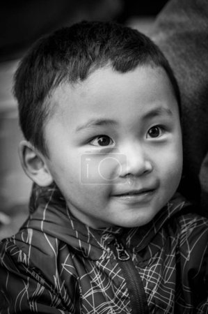 Photo for SHIGATSE, TIBET, CHINA - AUGUST, 21 2018: Unidentified little Tibetan child  in Shalu Monastery, Shigatse Prefecture, Tibet, China - Royalty Free Image